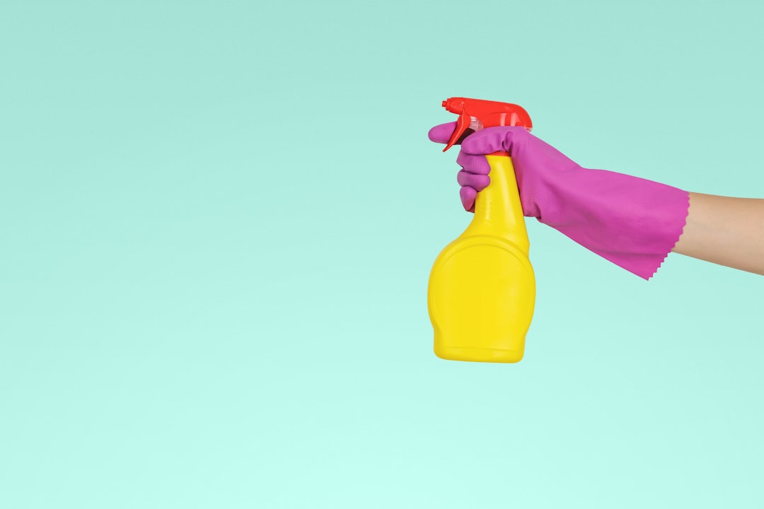 services-02 person-holding-yellow-plastic-spray-bottle-zmnefoi3k